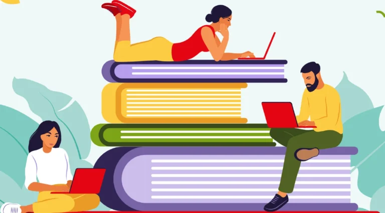 Studerende sidder på en stabel bøger og bruger deres bærbare computere